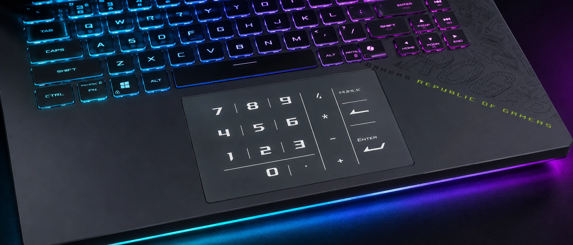 Close-up ultrawide view of the ASUS ROG Strix G16 keyboard and illuminated glass NumberPad touchpad